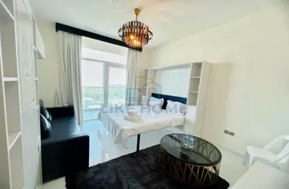Living / Dining Room image for: Apartment - 1 Bathroom for rent in Miraclz Tower by Danube - Arjan - Dubai, Image 1