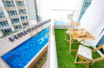 Pool image for: Apartment - 1 Bathroom for rent in Viridis C - Viridis Residence and Hotel Apartments - Damac Hills 2 - Dubai, Image 1