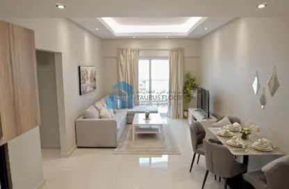 Living / Dining Room image for: Apartment - 2 Bedrooms - 2 Bathrooms for rent in Hera Tower - Dubai Sports City - Dubai, Image 1