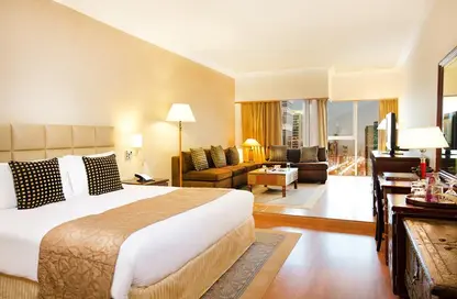 صورة لـ غرفة- غرفة النوم النزل و الشقق الفندقية - 1 حمام للايجار في فندق وبرج ميلينيوم بلازا - شارع الشيخ زايد - دبي ، صورة رقم 1