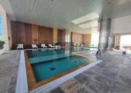Pool image for: Apartment - 2 bedrooms - 3 bathrooms for rent in Bloom Central - Al Tibbiya - Abu Dhabi, Image 1