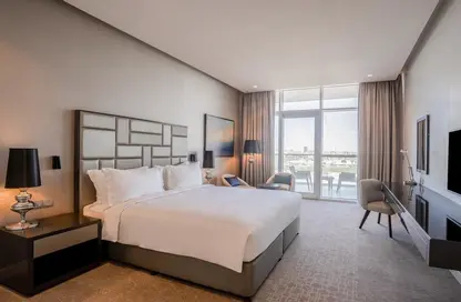 Room / Bedroom image for: Apartment - 1 Bathroom for sale in Radisson Dubai DAMAC Hills - DAMAC Hills - Dubai, Image 1