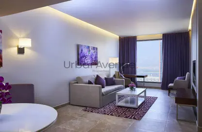 Living Room image for: Apartment - 2 Bedrooms - 2 Bathrooms for rent in Mercure Dubai Barsha Heights Hotel Suites  and  Apartments - Barsha Heights (Tecom) - Dubai, Image 1
