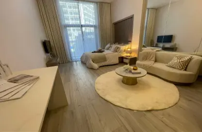 Living Room image for: Apartment - 1 Bedroom - 2 Bathrooms for sale in Laya Heights - Dubai Studio City - Dubai, Image 1
