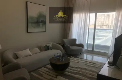 Living Room image for: Apartment - 2 Bedrooms - 2 Bathrooms for sale in AZHA Community - Al Amerah - Ajman, Image 1