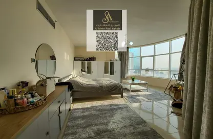 شقة - غرفة نوم - 2 حمامات للايجار في أورينت تاور 1 - أورينت تاور - البستان - عجمان