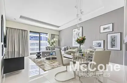 Living / Dining Room image for: Apartment - 1 Bedroom - 2 Bathrooms for rent in Tower A - DAMAC Towers by Paramount - Business Bay - Dubai, Image 1