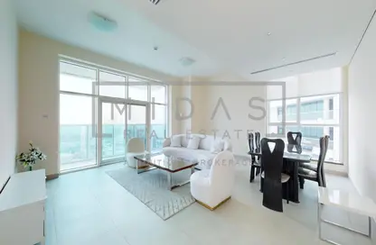 Living / Dining Room image for: Apartment - 2 Bedrooms - 3 Bathrooms for rent in Marina Arcade Tower - Dubai Marina - Dubai, Image 1