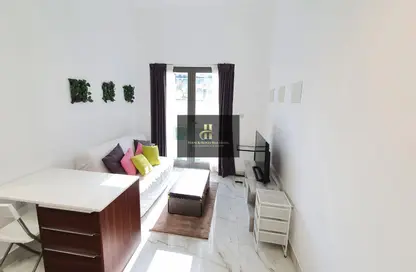 Living Room image for: Apartment - 1 Bedroom - 2 Bathrooms for rent in Joya Verde Residences - Jumeirah Village Circle - Dubai, Image 1