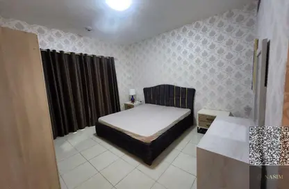 شقة - غرفة نوم - 2 حمامات للايجار في أورينت تاور 1 - أورينت تاور - البستان - عجمان