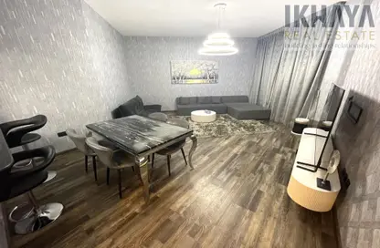 Living / Dining Room image for: Apartment - 1 Bedroom - 2 Bathrooms for sale in Kahraman - Bab Al Bahar - Al Marjan Island - Ras Al Khaimah, Image 1