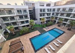 Pool image for: Apartment - 1 bedroom - 2 bathrooms for sale in Prime Views by Prescott - Meydan Avenue - Meydan - Dubai, Image 1