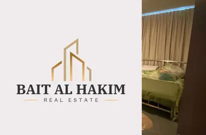 شقة - غرفة نوم - 2 حمامات للايجار في أورينت تاور 1 - أورينت تاور - البستان - عجمان