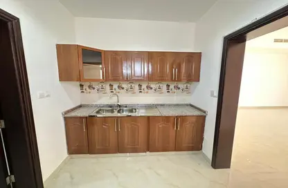 Kitchen image for: Apartment - 1 Bathroom for rent in Khalifa City A Villas - Khalifa City A - Khalifa City - Abu Dhabi, Image 1