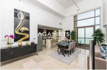 Living / Dining Room image for: Duplex - 2 Bedrooms - 2 Bathrooms for sale in Shams 1 - Shams - Jumeirah Beach Residence - Dubai, Image 1