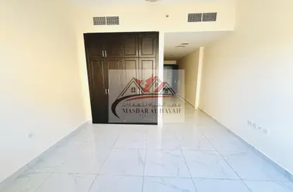 Room / Bedroom image for: Apartment - 1 Bathroom for rent in Amber Tower - Muwaileh - Sharjah, Image 1