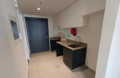 Kitchen image for: Apartment - 1 Bathroom for rent in East Village - Aljada - Sharjah, Image 1