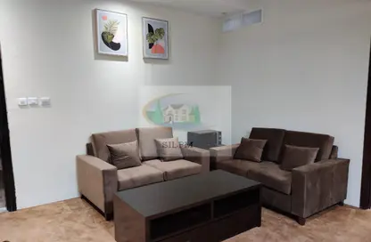 Living Room image for: Apartment - 1 Bedroom - 1 Bathroom for rent in Hamdan Street - Abu Dhabi, Image 1