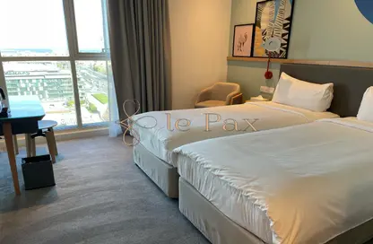Room / Bedroom image for: Apartment - 1 Bathroom for sale in Rove City Walk - City Walk - Dubai, Image 1