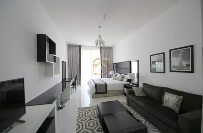 Living Room image for: Apartment - 1 Bathroom for rent in Giovanni Boutique Suites - Dubai Sports City - Dubai, Image 1