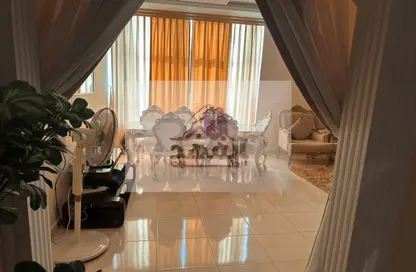 Living / Dining Room image for: Apartment - 2 Bedrooms - 3 Bathrooms for rent in Orient Tower 1 - Orient Towers - Al Bustan - Ajman, Image 1