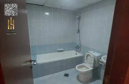 شقة - غرفة نوم - 2 حمامات للايجار في أورينت تاور 1 - أورينت تاور - البستان - عجمان
