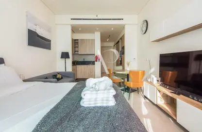 Living Room image for: Apartment - 1 Bathroom for rent in Signature Livings - Jumeirah Village Circle - Dubai, Image 1