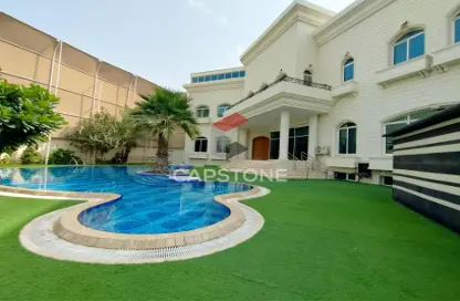 Pool image for: Villa - 7 Bedrooms for rent in Al Karamah - Abu Dhabi, Image 1