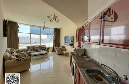 شقة - غرفة نوم - 2 حمامات للايجار في أورينت تاور 1 - أورينت تاور - البستان - عجمان