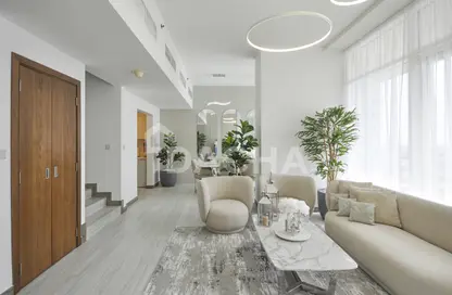 Living Room image for: Duplex - 2 Bedrooms - 3 Bathrooms for sale in Hameni Tower - Jumeirah Village Circle - Dubai, Image 1