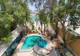 Pool image for: Villa - 4 bedrooms - 6 bathrooms for rent in Royal Marina Villas - Marina Village - Abu Dhabi, Image 1