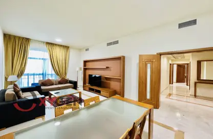 Living / Dining Room image for: Apartment - 2 Bedrooms - 3 Bathrooms for rent in Vision Twin Towers - Al Najda Street - Abu Dhabi, Image 1