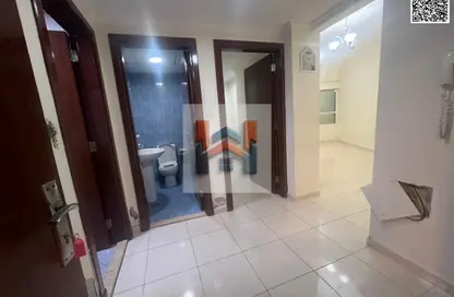 شقة - غرفة نوم - 2 حمامات للايجار في أورينت تاور 1 - أورينت تاور - البستان - عجمان