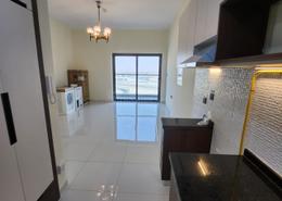 Kitchen image for: Studio - 1 bathroom for rent in Wavez Residence - Liwan - Dubai Land - Dubai, Image 1