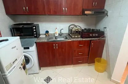 شقة - غرفة نوم - 2 حمامات للايجار في أورينت تاور 1 - أورينت تاور - البستان - عجمان