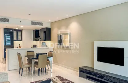 Living / Dining Room image for: Apartment - 1 Bedroom - 2 Bathrooms for sale in DAMAC Maison Canal Views - Business Bay - Dubai, Image 1