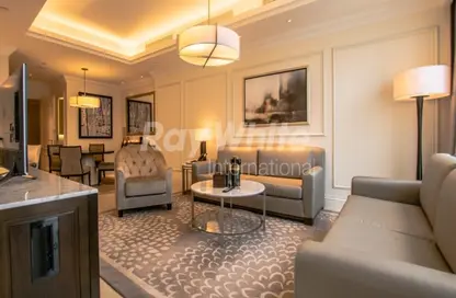 Living Room image for: Apartment - 1 Bedroom - 2 Bathrooms for rent in Kempinski BLVD - Downtown Dubai - Dubai, Image 1