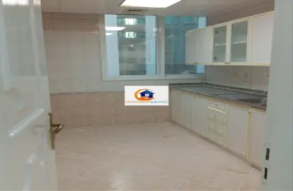 Kitchen image for: Apartment - 3 Bedrooms - 3 Bathrooms for rent in Tourist Club Area - Abu Dhabi, Image 1