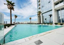 Pool image for: Apartment - 1 bedroom - 2 bathrooms for rent in Regina Tower - Jumeirah Village Circle - Dubai, Image 1