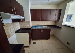 صورةمطبخ لـ: شقة - 1 غرفة نوم - 2 حمامات للبيع في شقق الخريف - سيزون كوميونيتي - قرية الجميرا سركل - دبي, صورة 1