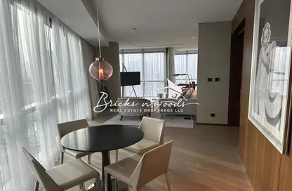 Living / Dining Room image for: Apartment - 1 Bedroom - 2 Bathrooms for sale in Tower C - DAMAC Towers by Paramount - Business Bay - Dubai, Image 1