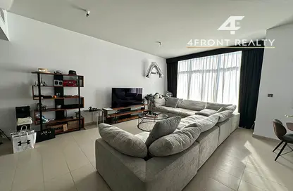 Living Room image for: Apartment - 2 Bedrooms - 3 Bathrooms for sale in Oia Residence - Motor City - Dubai, Image 1