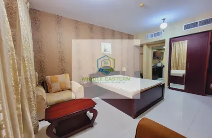 صورة لـ غرفة- غرفة النوم شقة - 1 حمام للايجار في الوحدة - أبوظبي ، صورة رقم 1