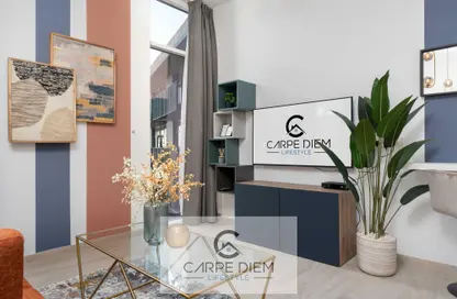 Living Room image for: Apartment - 1 Bathroom for rent in Belgravia 3 - Belgravia - Jumeirah Village Circle - Dubai, Image 1