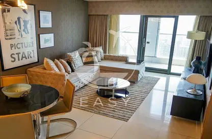 صورة لـ غرفة المعيشة / غرفة الطعام شقة - غرفة نوم - 2 حمامات للايجار في فندق ومساكن برج باراماونت - الخليج التجاري - دبي ، صورة رقم 1