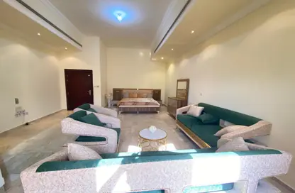 Living Room image for: Apartment - 1 Bathroom for rent in Khalifa City A - Khalifa City - Abu Dhabi, Image 1