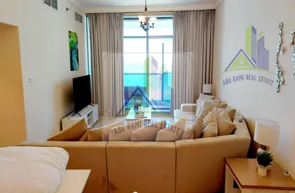 Living Room image for: Apartment - 2 Bedrooms - 3 Bathrooms for rent in Corniche Tower - Ajman Corniche Road - Ajman, Image 1