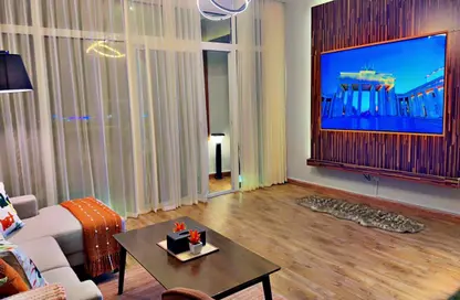 Living Room image for: Apartment - 2 Bedrooms - 2 Bathrooms for sale in Horizon Towers - Ajman Downtown - Ajman, Image 1