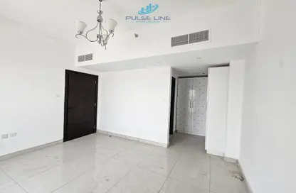 Empty Room image for: Apartment - 1 Bedroom - 2 Bathrooms for sale in Equiti Apartments - Phase 2 - International City - Dubai, Image 1