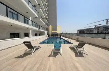Pool image for: Apartment - 2 Bedrooms - 3 Bathrooms for sale in Al Furjan - Dubai, Image 1